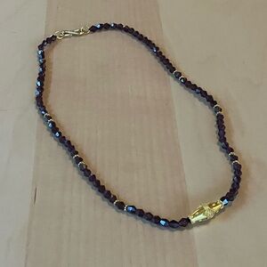 Strand of garnet beads with gold accents